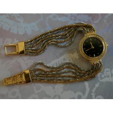 Vintage Silver and Gold Ladies Swiss Dress Watch with Crystals surrounding the Black Face
