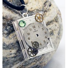 Unique Steampunk silver-plated book locket with vintage watch face, watch parts and green Swarovski crystal rhinestone