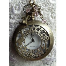 Pocket watch pendant, features assorted charms and heart shaped lampwork beads on antique bronze chain