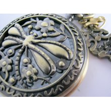 Dragon fly garden theme pocket watch. Face pops open. With brass chain necklace and key charm