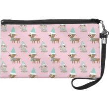 Bunnies and Reindeer over Pale Pink Holiday Art Wristlet Clutches