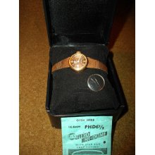 Early 1960s Jules Jurgenson Woman's 17 Jewel Wrist Watch - Stainless Steel - Gold