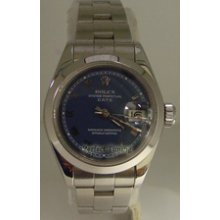 Rolex Ladies Stainless Steel Date Model With Oyster Bracelet And Blue Dial With White Gold Roman Numerals With Smooth Bezel. 