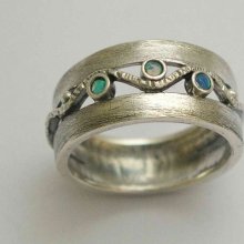 Brushed sterling silver ring with blue opal gemstones - Entertainment tonight .