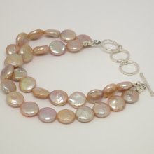 Fresh water pearl two strand bracelet. approx. 9.5mm pearls â€“ 7 Â¼ to 8 Â¼ inch adjustable. Sterling silver clasp. SKU:1923