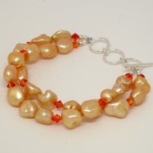Fresh water pearls and Swarovski double strand bracelet. approx. 10mm fresh water pearls - 7 Â¼ to 8 Â¼ inch adjustable. Sterling silver clasp. SKU:2065