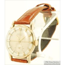 Louvic 17J vintage wrist watch, heavy yellow gold filled & stainless steel round case, checkerboard engraved dial, leather band